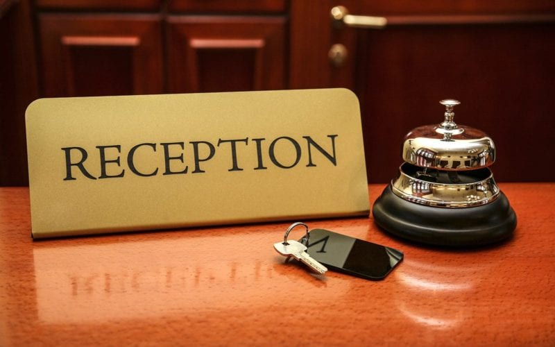 Reception name card, with service bell and room key.