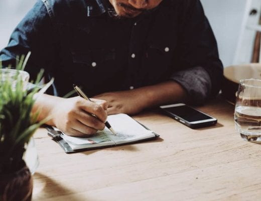 Man Making a Checklist for an event