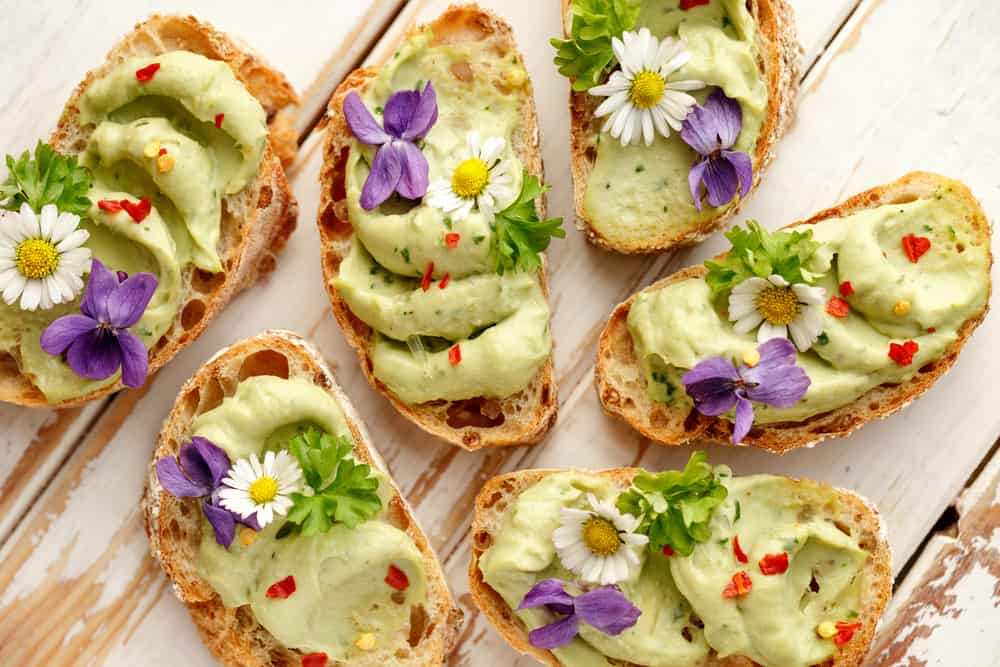 avocado toast canapes with edible flowers