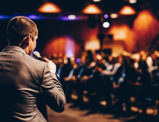 speaker giving a talk at a corporate event